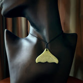 Hand carved small New Zealand Jade whale tail pendant. Carved for NZ Pacific. Handmade ocean themed jewellery for sale online. Hand made by Kyohei Noguchi.